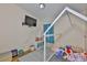 Charming ' bedroom featuring a house frame bed, mounted television, and a bright window at 311 Sugar Creek Dr, Plant City, FL 33563
