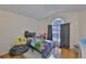 room showcases a unique arched window and vaulted ceiling at 311 Sugar Creek Dr, Plant City, FL 33563