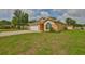 Charming single-story home with a manicured lawn, attached garage, and neutral paint at 311 Sugar Creek Dr, Plant City, FL 33563