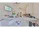 Kitchen with breakfast bar, modern lighting, and stainless steel appliances at 311 Sugar Creek Dr, Plant City, FL 33563