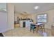 Bright, open kitchen and dining area with tile flooring, and modern appliances at 311 Sugar Creek Dr, Plant City, FL 33563