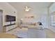 Comfortable living room with plush sofa, flat screen television, and modern decor at 311 Sugar Creek Dr, Plant City, FL 33563