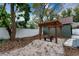 Backyard with pergola, fire pit, and gravel landscaping at 3506 N Arlington Ave, Tampa, FL 33603