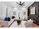 Spacious living room with hardwood floors, a cozy sectional sofa, and a fireplace at 3506 N Arlington Ave, Tampa, FL 33603
