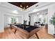 Game room with pool table, hardwood floors, and views of living room and kitchen at 3506 N Arlington Ave, Tampa, FL 33603