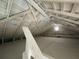 Spacious attic with exposed rafters and a small window at 3506 N Arlington Ave, Tampa, FL 33603