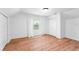 Cozy bedroom with hardwood floors, natural light, and double door closet at 3506 N Arlington Ave, Tampa, FL 33603