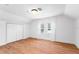 Bedroom featuring neutral walls, hardwood floors, a window and built in closet at 3506 N Arlington Ave, Tampa, FL 33603