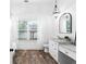 Elegant bathroom with white cabinets and marble countertops at 3506 N Arlington Ave, Tampa, FL 33603