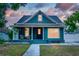 Charming home with a covered front porch, perfect for relaxing outdoors at 3506 N Arlington Ave, Tampa, FL 33603