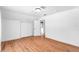 Spacious bedroom with wood floors and access to a bathroom at 3506 N Arlington Ave, Tampa, FL 33603