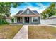 Charming craftsman home with a welcoming front porch and well-maintained lawn at 3506 N Arlington Ave, Tampa, FL 33603