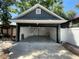 Spacious detached garage with an open door and overhead storage access at 3506 N Arlington Ave, Tampa, FL 33603