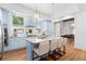 Light blue kitchen with granite countertops, a center island with bar stool seating, and stainless-steel appliances at 3506 N Arlington Ave, Tampa, FL 33603