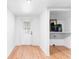 Mud room with white walls, hardwood floors, a door and a shelf space at 3506 N Arlington Ave, Tampa, FL 33603