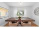 Bright dining room with large wooden table and view into backyard at 3506 N Arlington Ave, Tampa, FL 33603