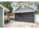 Detached garage with dark brown door and driveway at 3506 N Arlington Ave, Tampa, FL 33603