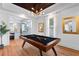 Game room with pool table, hardwood floors, and a view of the kitchen at 3506 N Arlington Ave, Tampa, FL 33603
