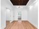Bright bedroom with hardwood floors and a view to the backyard at 3506 N Arlington Ave, Tampa, FL 33603