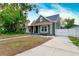 Craftsman home with a driveway and fenced yard at 3506 N Arlington Ave, Tampa, FL 33603