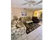 Living room with floral sofas and a coffee table at 4215 E Bay Dr # 1013B, Clearwater, FL 33764