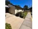Tan house exterior with walkway and small landscaping at 4215 E Bay Dr # 1013B, Clearwater, FL 33764