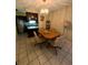 Casual dining area with wood table and chairs, adjacent to kitchen at 4215 E Bay Dr # 1013B, Clearwater, FL 33764