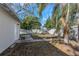 Small backyard with a chain link fence and palm trees at 4601 8Th N Ave, St Petersburg, FL 33713