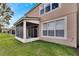 Private screened porch and manicured lawn at 4716 Barnstead Dr, Riverview, FL 33578