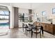 Formal dining room features a dark wood table, statement lighting, and a buffet at 5015 Stoney Point Gln, Lakewood Ranch, FL 34211