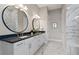 Double vanity bathroom with marble flooring and walk-in shower at 5015 Stoney Point Gln, Lakewood Ranch, FL 34211