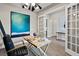 Bright home office features built-in shelving, wood desk, and large artwork at 5015 Stoney Point Gln, Lakewood Ranch, FL 34211