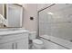 Bathroom with white vanity, tub, and shower at 5015 Stoney Point Gln, Lakewood Ranch, FL 34211