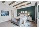 Spacious main bedroom with wood-look floors, large bed, and elegant decor at 5015 Stoney Point Gln, Lakewood Ranch, FL 34211