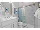 Modern bathroom with white vanity, glass shower, and patterned floor at 5015 Stoney Point Gln, Lakewood Ranch, FL 34211