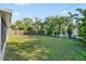 Large backyard with a wooden fence, providing privacy and space at 5419 Denver Ne St, St Petersburg, FL 33703