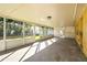 Covered screened porch with concrete flooring, overlooking the backyard at 5419 Denver Ne St, St Petersburg, FL 33703