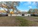 Home's rear elevation, showcasing a large backyard at 615 16Th Nw St, Largo, FL 33770