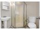 Bathroom with shower stall, pedestal sink, and toilet at 615 16Th Nw St, Largo, FL 33770