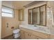 Small bathroom with beige tile, vanity, and shower at 615 16Th Nw St, Largo, FL 33770