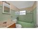 Bathroom with bathtub, sink, and toilet at 615 16Th Nw St, Largo, FL 33770