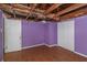 Needs renovation, purple walls, wood floors, and a double door closet at 615 16Th Nw St, Largo, FL 33770
