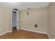 Small bedroom with wood floors and a door to another room at 615 16Th Nw St, Largo, FL 33770