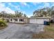House exterior with stone facade and two-car garage at 615 16Th Nw St, Largo, FL 33770