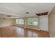 Large living room with hardwood floors needing renovation at 615 16Th Nw St, Largo, FL 33770
