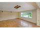 Living room with hardwood floors and a large window at 615 16Th Nw St, Largo, FL 33770
