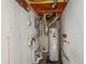 Unfinished mechanical room with water heater and exposed plumbing at 615 16Th Nw St, Largo, FL 33770