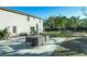 Private backyard oasis with patio and grassy area at 7700 N Highland Ave, Tampa, FL 33604