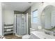 Updated bathroom with a walk-in shower and modern vanity at 7700 N Highland Ave, Tampa, FL 33604