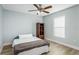 Cozy bedroom with a double bed, and built-in shelving at 7700 N Highland Ave, Tampa, FL 33604